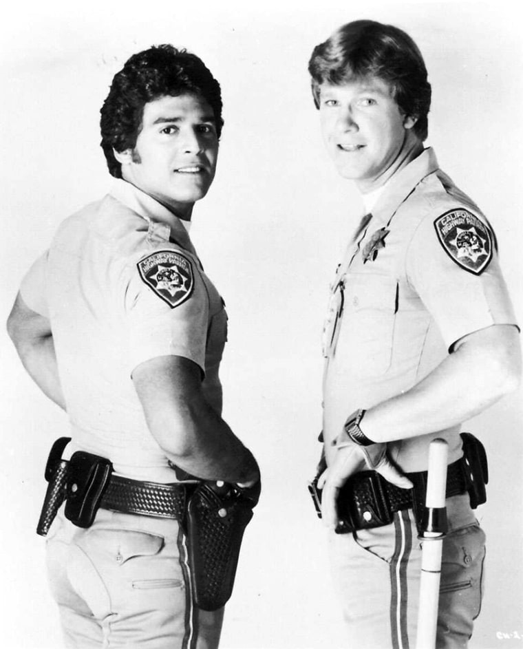 KRT BOOKS STORY SLUGGED: ESTRADA KRT FILE PHOTOGRAPH VIA SUN-SENTINEL, SOUTH FLORIDA (MIAMI OUT, BOCA RATON OUT) (KRT103 -May 14) Erik Estrada, (left), and Larry Wilcox played California Highway Patrol Officers in NBC's cop drama \"CHiPs, \" from 1977-1983. Estrada has recently written an autobiography entitled \"My Road From Harlem to Hollywood\" that details his rags-to-riches odyssey, his downfall and comeback. (Jak32101) 1997 (B&W ONLY) (Undated File Photo) This photo may of interest to At-Risk Readers